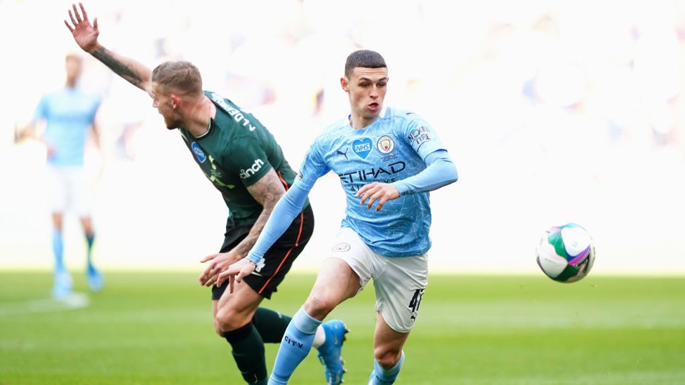 PHIL-ING IT : The lively Foden bursts forward early on.