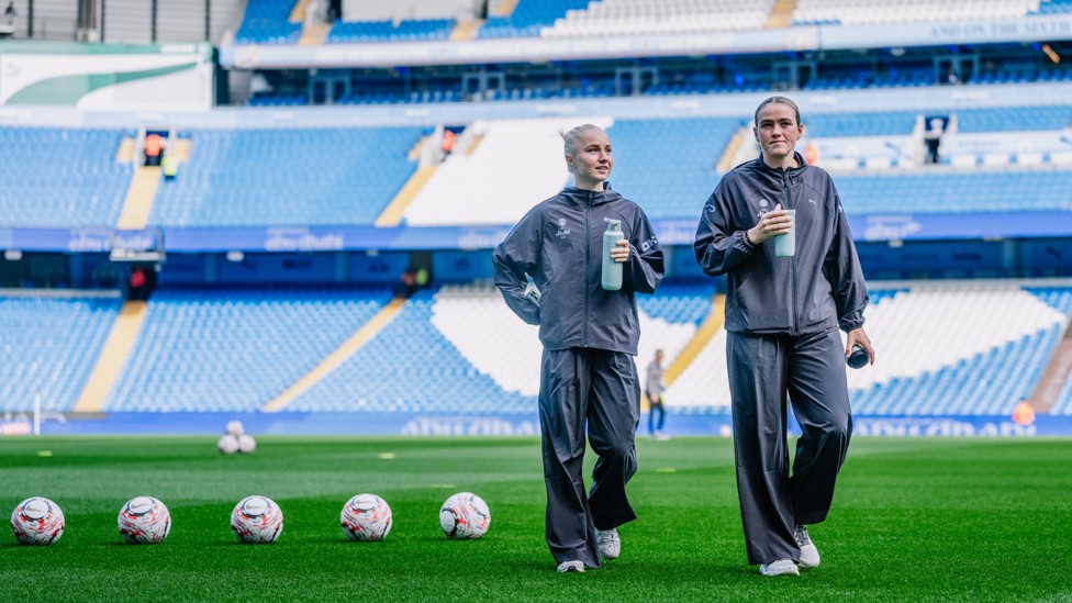 CHECKING OUT THE VIEW : Laura Blindkilde Brown and Grace Clinton take in the view from the Etihad pitch. 
