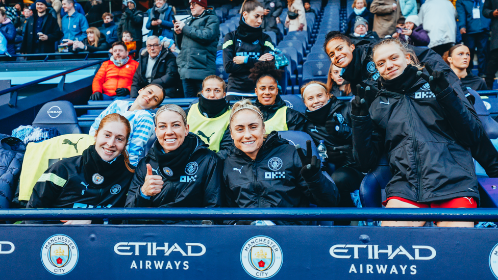 SUPPORTING SUBS : Our substitutes smiling and supporting the team.