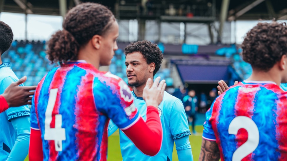 WELCOME BACK: Oscar Bobb takes part in the pre-match exchanges.