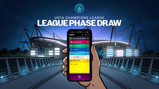 A hand holding a phone displaying a UEFA Champions League draw list in front of a lit-up stadium at night.