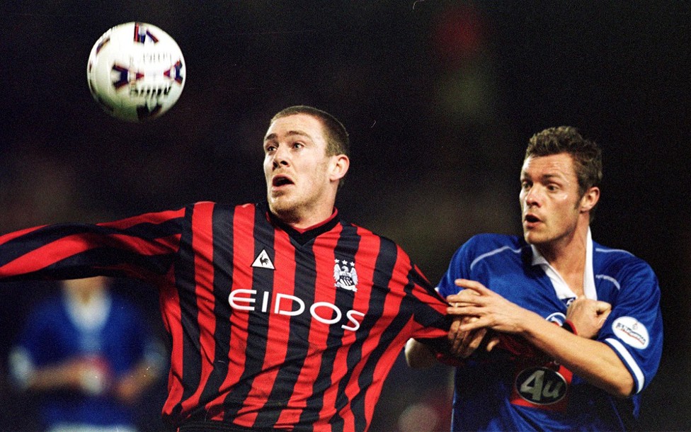 Horse play : Dunne up against Geoff Horsfield of Birmingham