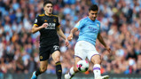 SLICK: Rodrigo calmly passes the ball as City look to find a way through in the second half. 