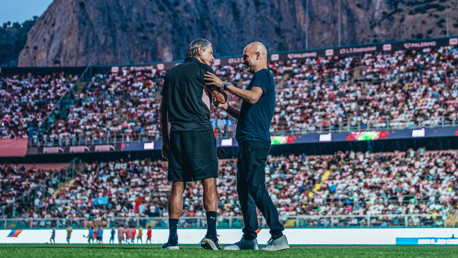 LEGENDS OF THE GAME: Pep and Palermo manager Filippo Inzaghi share a warm embrace ahead of kick-off.