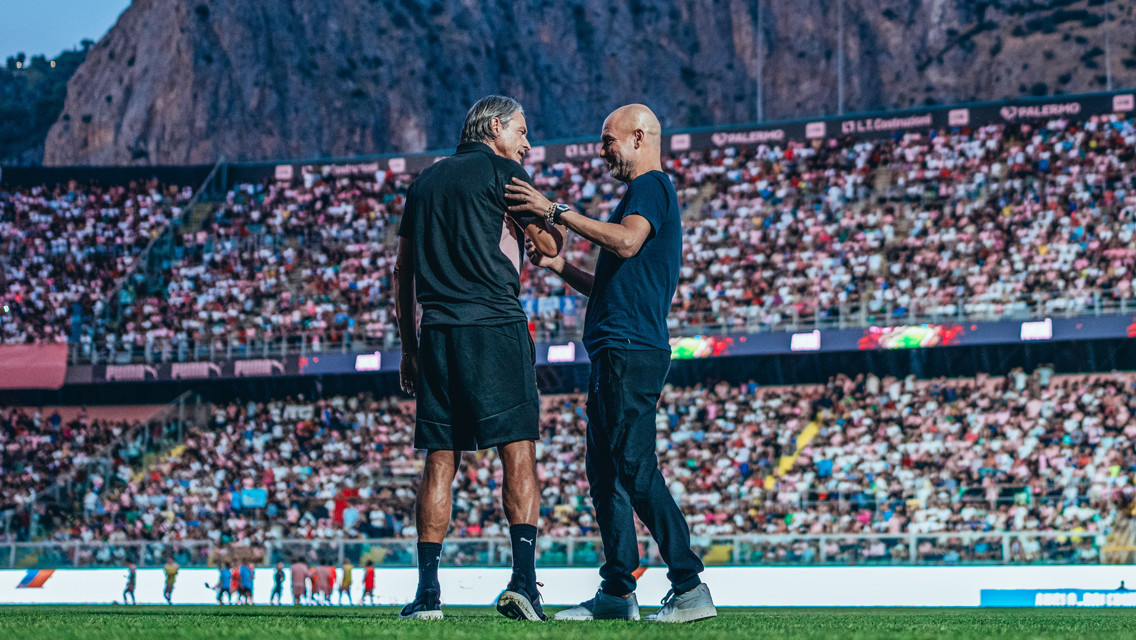 LEGENDS OF THE GAME: Pep and Palermo manager Filippo Inzaghi share a warm embrace ahead of kick-off.