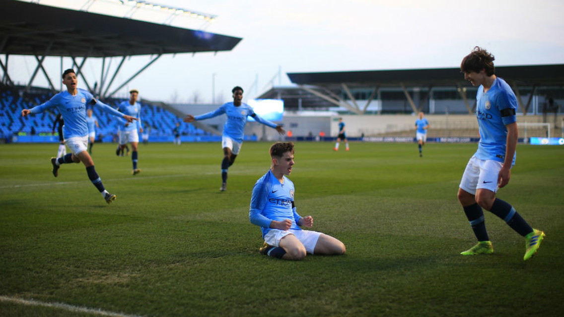 SLIDE RULE: Ben Knight celebrates after netting City's opener 