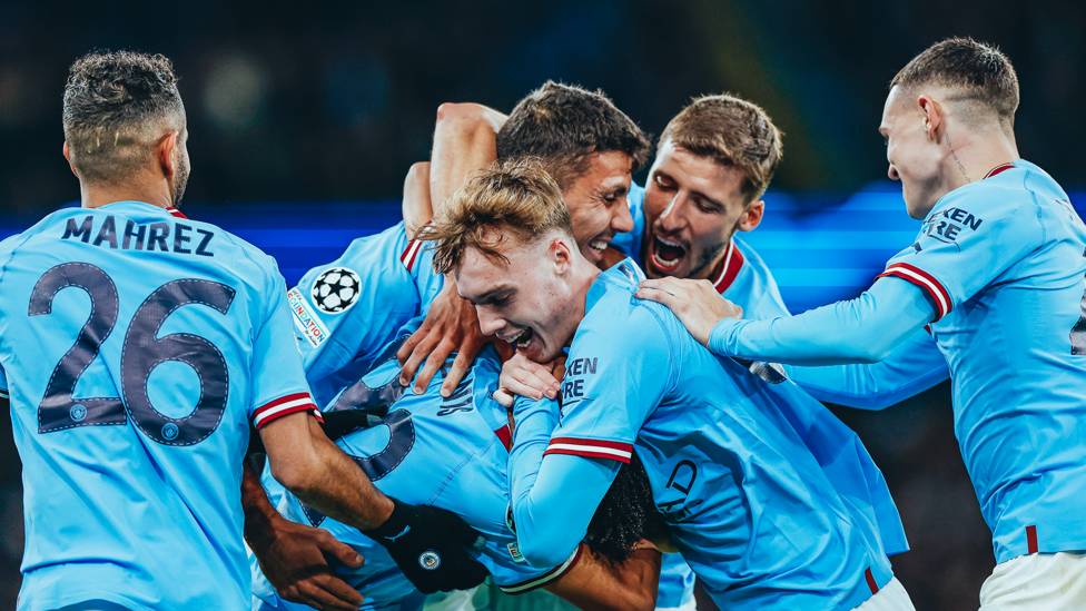 PILE ON : The rest of the squad join in to mob the teenager - what a moment!