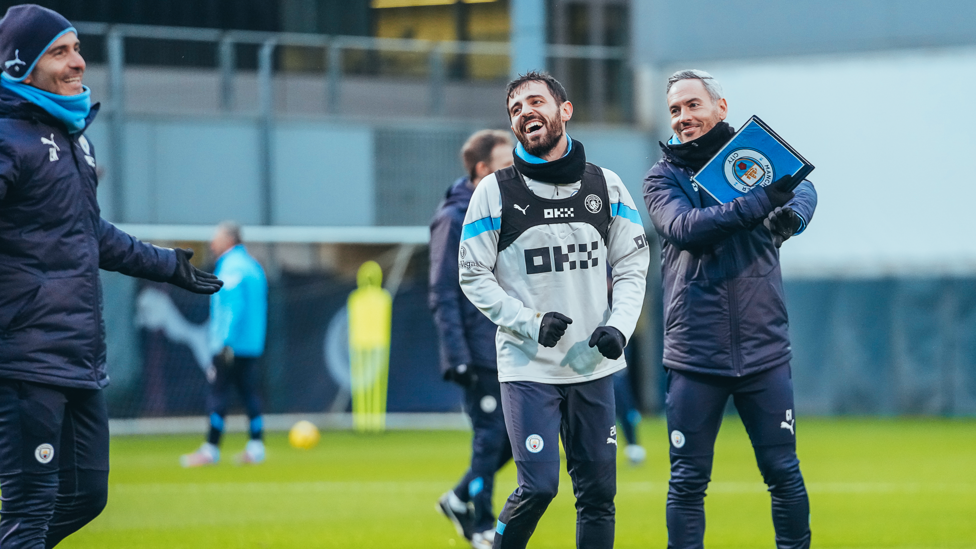 SILVA SMILES : Bernardo shares a joke with coaches Enzo Maresca and Carlos Vicens