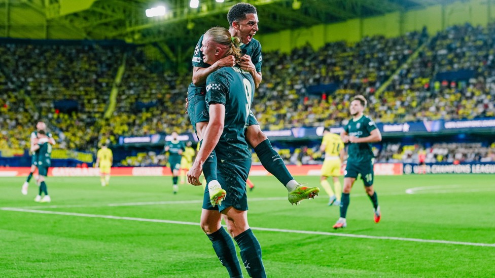 SCORER AND PROVIDER : Haaland races over to celebrate with Lewis.