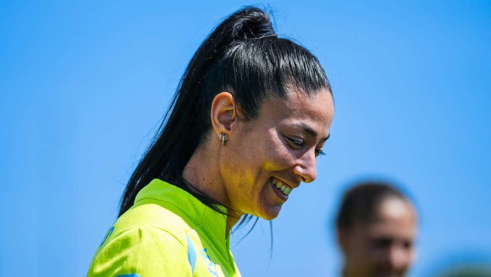 Leila Ouahabi against a sky blue backdrop