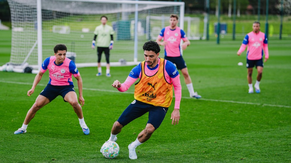 TWISTING AND TURNING : Rico Lewis puts Omar Marmoush under pressure.  