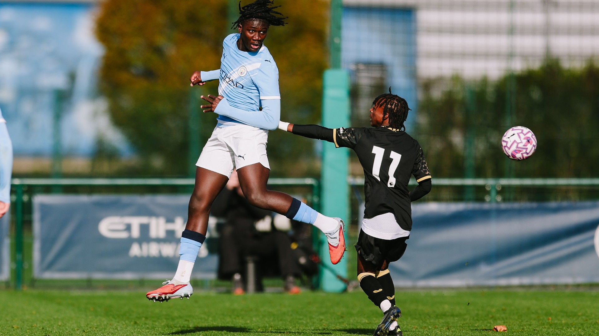 DEFENSIVE DUTIES : Yohann Obin rises highest to clear the danger.