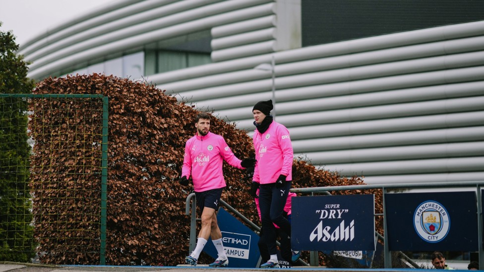 HERE WE GO : Ruben Dias and Erling Haaland make their way out for the session
