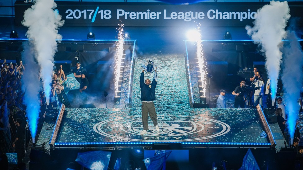 VINNIE RETURNS : Kompany holds aloft the 2017/18 Premier League trophy