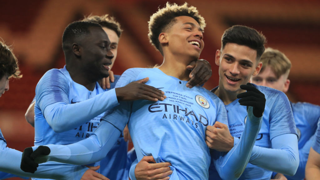 UP FOR THE CUP : Felix Nmecha is mobbed by his team-mates after opening the scoring