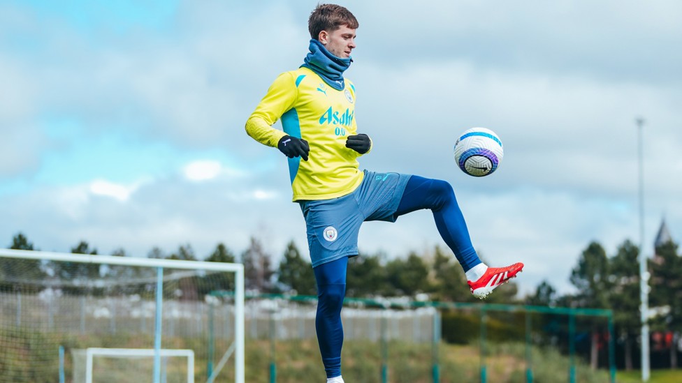 WRAPPED UP : Even local lad James McAtee needed to keep warm