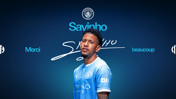 A graphic featuring a football player with the name Savinho, wearing a Manchester City jersey. The background is blue with the Manchester City logo at the top and the text 'Thank You.'