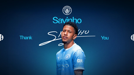 A graphic featuring a football player with the name Savinho, wearing a Manchester City jersey. The background is blue with the Manchester City logo at the top and the text 'Thank You.'