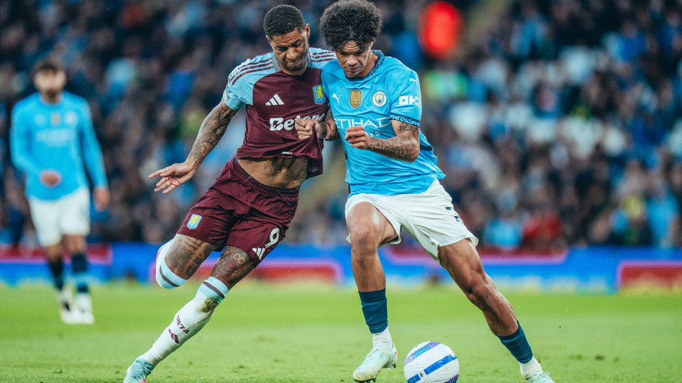 MANCUNIAN TUSSLE : O'Reilly and Rashford battle for the ball.
