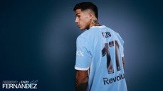A man wearing a light blue soccer jersey with the name 'ENZO' and number '17'. The jersey features Puma and Revolut branding. The text reads 'Welcome to City Enzo Fernandez'.