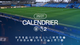 Image of a stadium with 'Joie Stadium' visible. Text overlay reads '26/27 Calendrier' with Manchester City and Premier League 2 logos below surrounded by various football club logos.