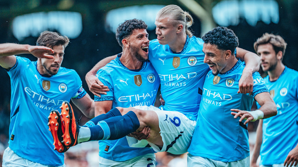 HOLDING HAALAND : The players celebrate!