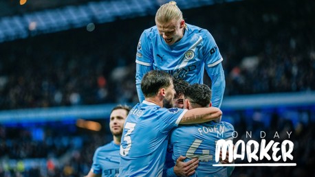 Manchester City players celebrating a goal at Etihad Stadium. Visible players are Ruben Dias, Phil Foden, and Erling Haaland. The 'Monday Marker' text on the image indicates it relates to a match highlight or event.