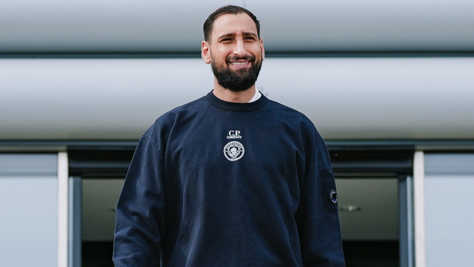 HAND IT TO GIGI: Gianluigi Donnarumma was in positive mood as City prepared to fly out. 