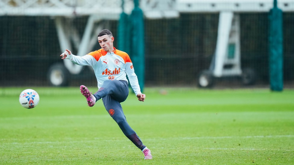 ONE OF OUR OWN : Phil Foden strikes towards goal.
