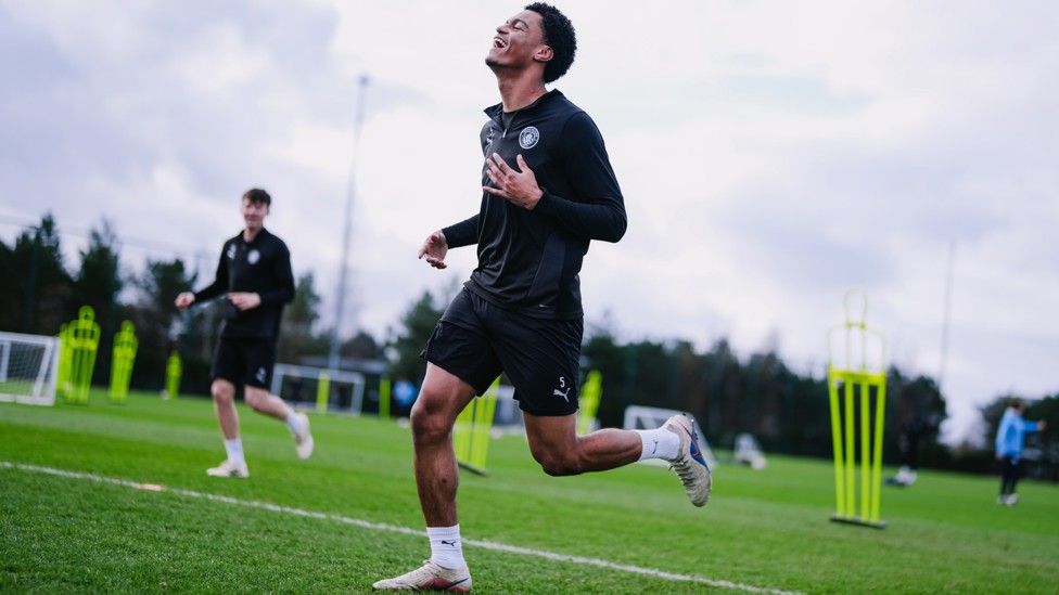 ALL SMILES : Leke Drake makes his way out to training.
