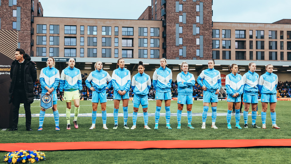 Show of support : The starting 11 lined up for the national anthem after laying a wreath in support for Ukraine