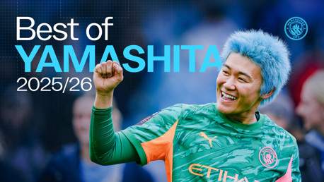 A football player from Manchester City celebrates with a raised fist and a smile, wearing a blue hairstyle and the team's green and orange kit. Text reads 'Best of Yamashita 2025/26' alongside the Manchester City logo.