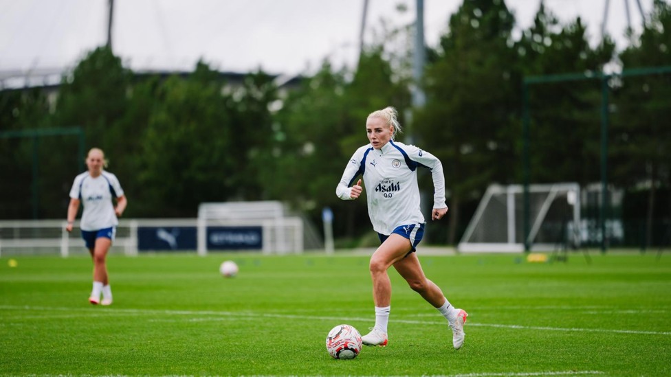 BIG STRIDES : Alex Greenwood on the ball