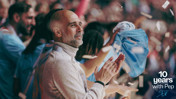 A crowd in Manchester City colors during a celebration, with confetti in the air and a '10 years with Pep' message in the corner.