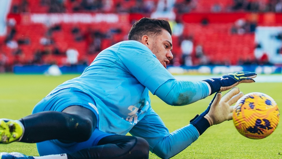 SAFE HANDS : Ederson gets a feel of the ball during the pre-match warm up.