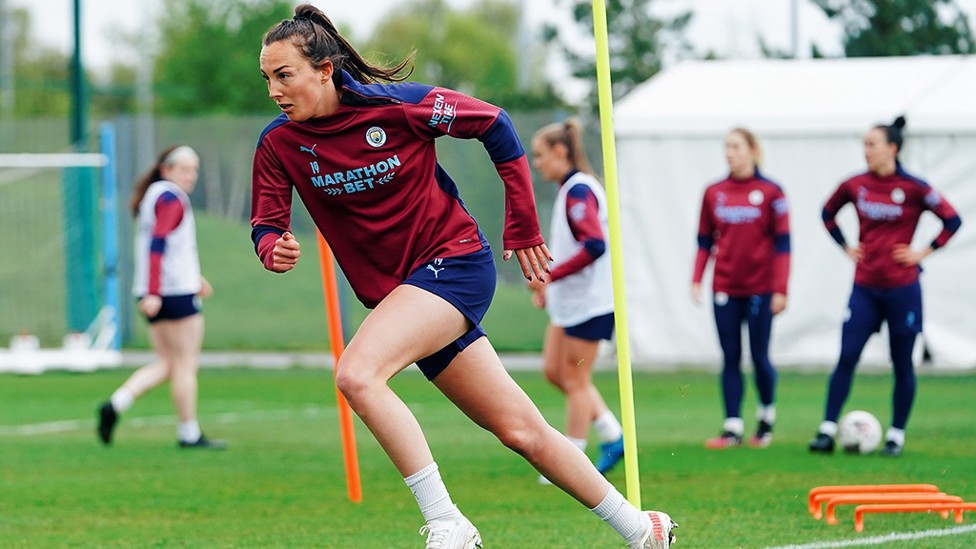 WEIR AND TEAR : Caroline gets her muscles going during the warm up session.