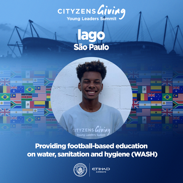 Image of Iago from Sao Paulo at Cityzens Giving Young Leaders Summit focused on football-based education in water, sanitation, and hygiene (WASH) with various flags in the background.