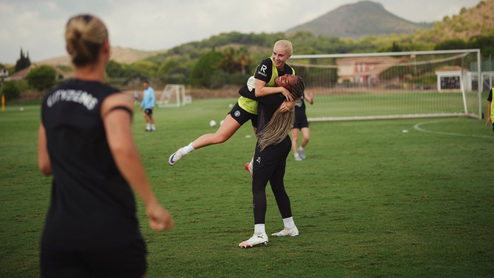 FUN AND GAMES: Laura Blidnkilde Brown and Khiara Keating share an embrace