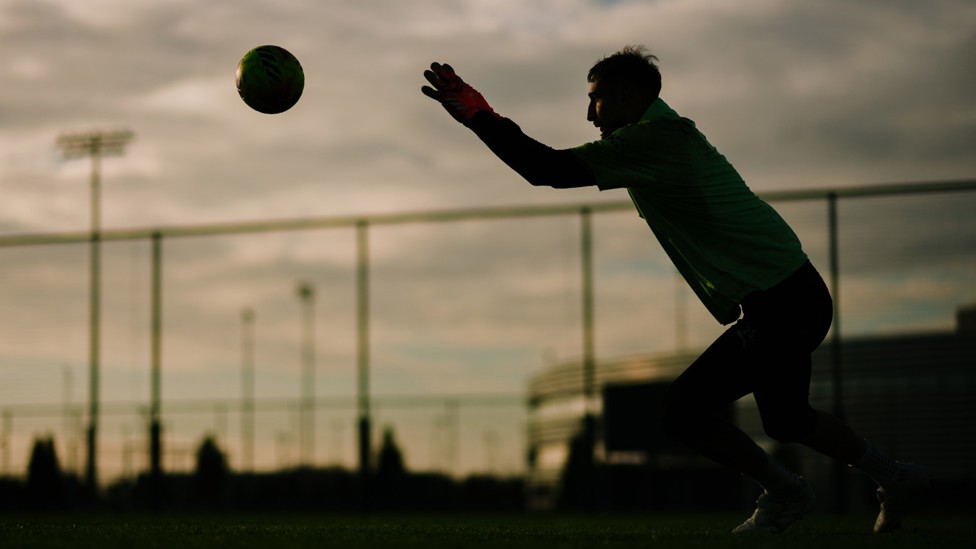 SAFE HANDS : Donnarumma watches the ball into his grasp