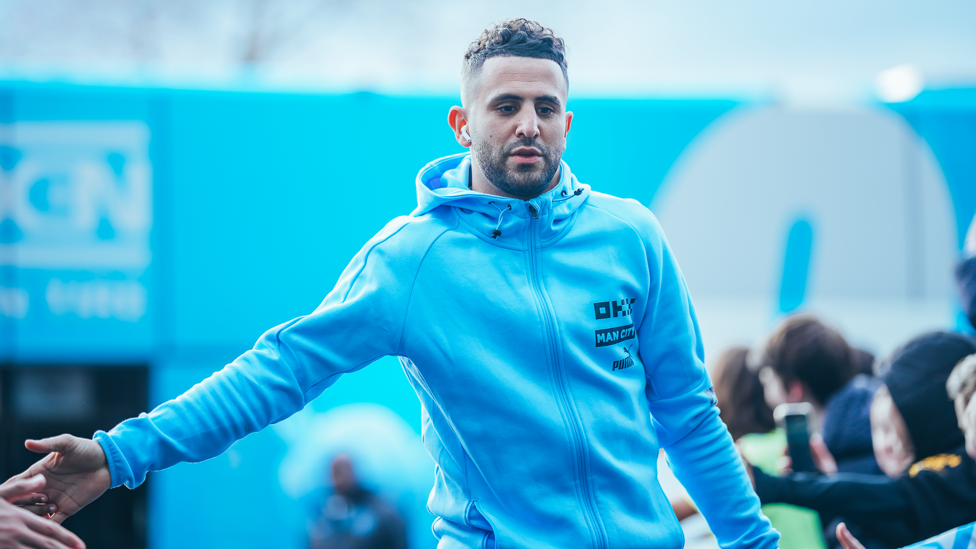 MEETING MAHREZ : Riyad arrives at the Etihad and greets the fans.