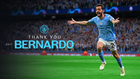 A Manchester City soccer player in a blue kit celebrates on a football field with outstretched arms. Text reads 'Thank You Bernardo 2017-2026' with the Manchester City logo.