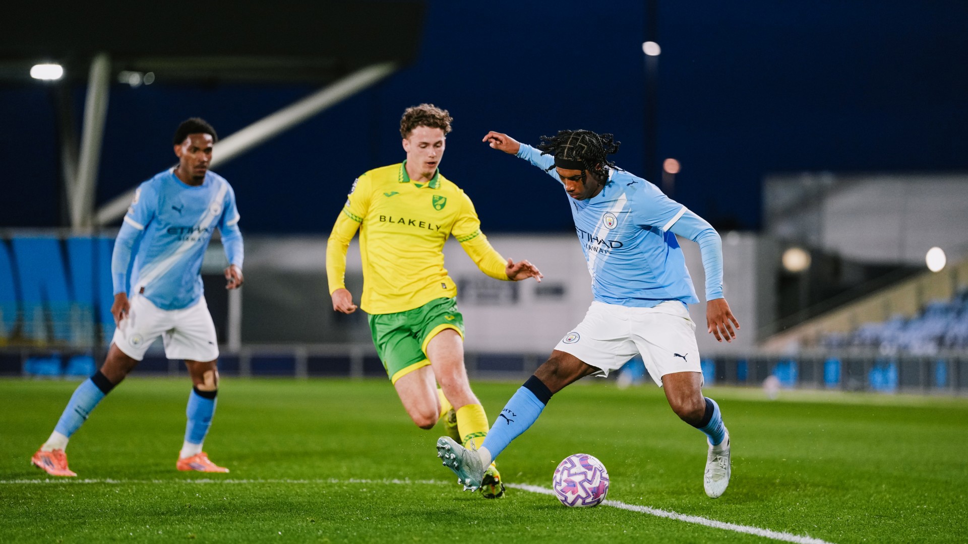 DANCING FEET : Reigan Heskey takes on his man.