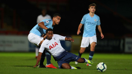 AT FULL STRETCH: City's Cameron Humphreys challenges Spurs' Shayon Harrison