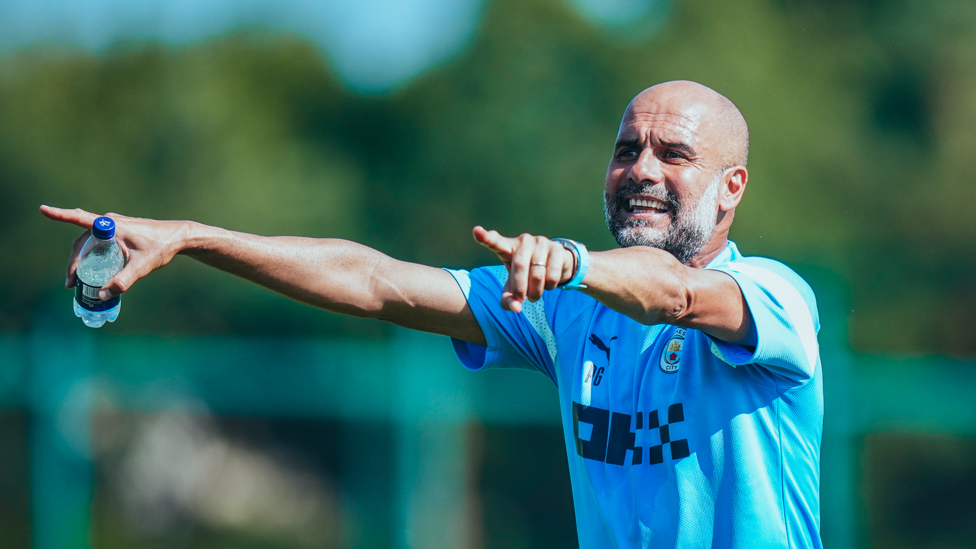 THE BOSS : Pep Guardiola gets his point across to the City players