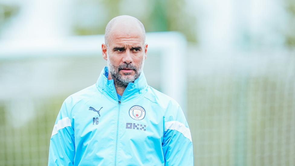 FOCUS TIME : After chatting to Thierry Henry, Pep Guardiola oversees Tuesday's session.