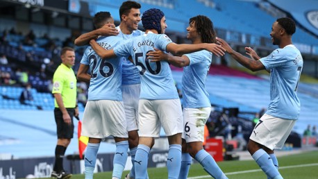GROUP HUG: The players share the love after the spectacular opener.