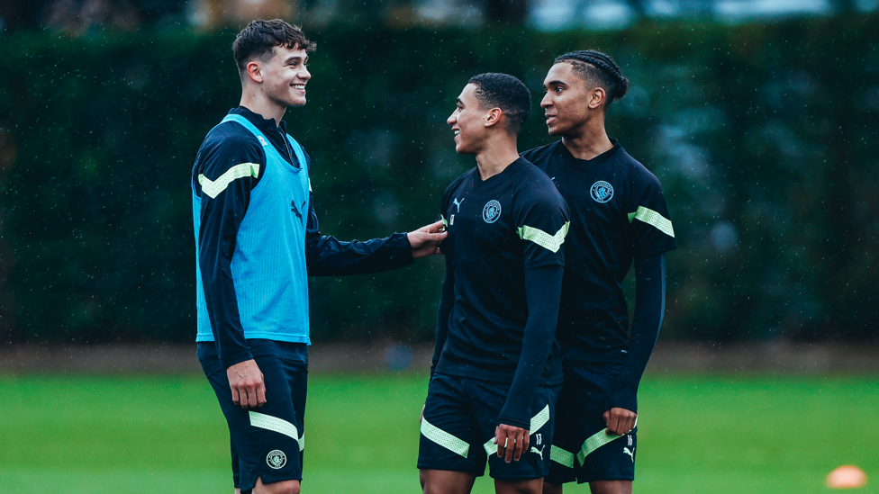 A SPOT OF RAIN : Isaac Smith and Ezra Carrington share a joke