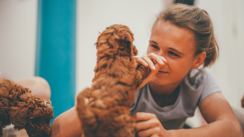 PAWFECT MEETING : Kerstin Casparij loves getting to know one of the Paw Yoga puppies