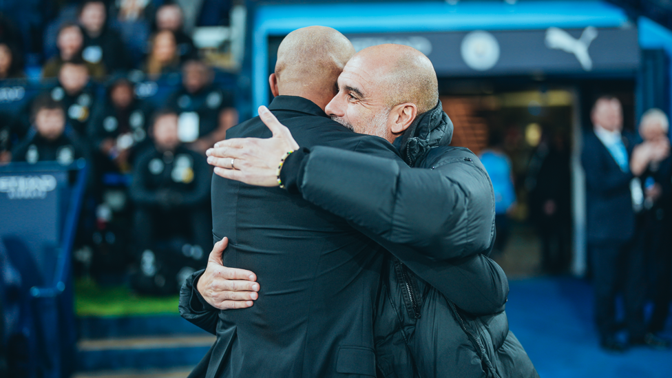 BOSSES : Guardiola and City legend Kompany share a warm embrace ahead of kick-off.