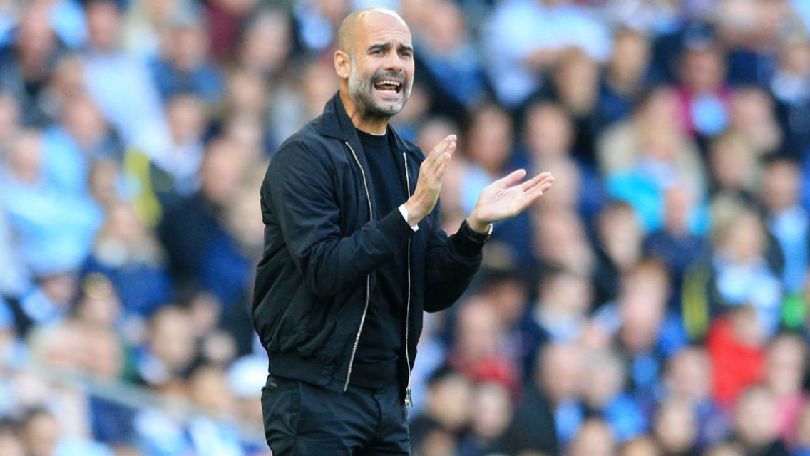 CLAP YOUR HANDS: Pep tries to get his team going from the sidelines 